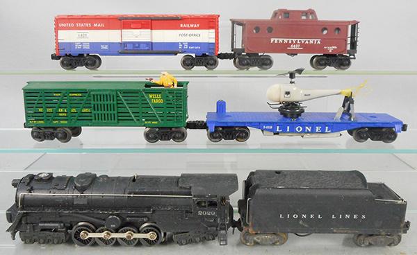LIONEL TRAIN SET: O ga, 2020 turbine loco, missing nose decal, 6020W tender, 3370 Sheriff & Outlaw car, missing Sheriff's head, 3419 flat w/helicopter, tail rotor broken, 6428 US Mail box car, 6437 PA caboose, C6-8.