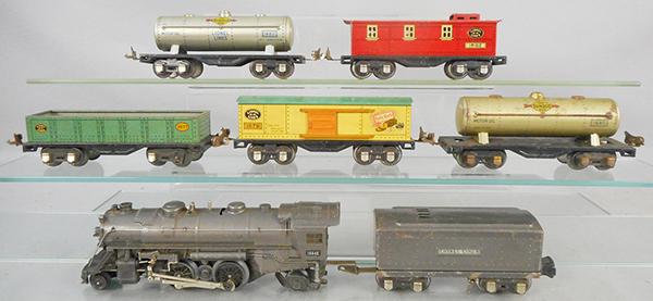 LIONEL TRAIN SET: O ga, 1664E loco, cowcatcher front step bent, 1689W tender, 1677 gondola, 1679 box car, 2 #1680 Sunoco tanks, 1682 caboose, C5-6.