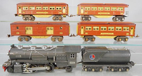 LIONEL TRAIN SET: O ga, 263E loco, gunmetal w/nickel trim, 263W tender, 615 baggage, dent on roof, oxidation on trucks, wheels & couplers, 2 #613 Pullmans, 614 obsv, set is missing 2 journal boxes & 3 handrails, C5-7.
