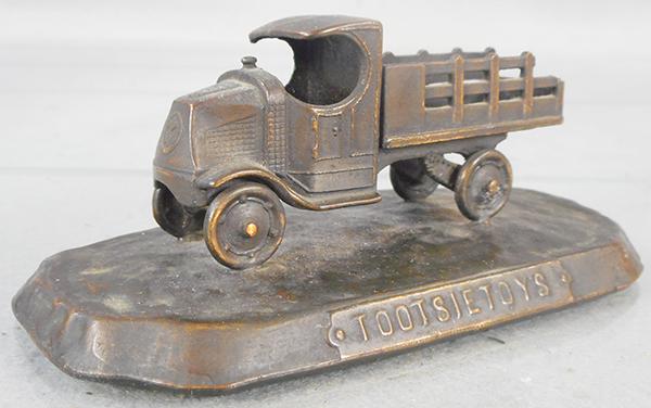 TOOTSIETOY BRONZE PAPERWEIGHT (1 of 2)