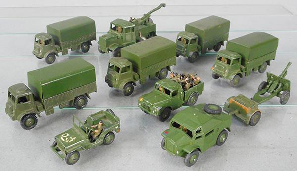 11 DINKY MILITARY VEHICLES: 5 #623 Army Wagons, 661 Recovery Tractor, missing hook, 641 1-ton Truck, missing canopy, 153 Jeep, 688 Artillery Tractor, 687 Trailer, 688 Field Gun, w/11 drivers, C4-6.