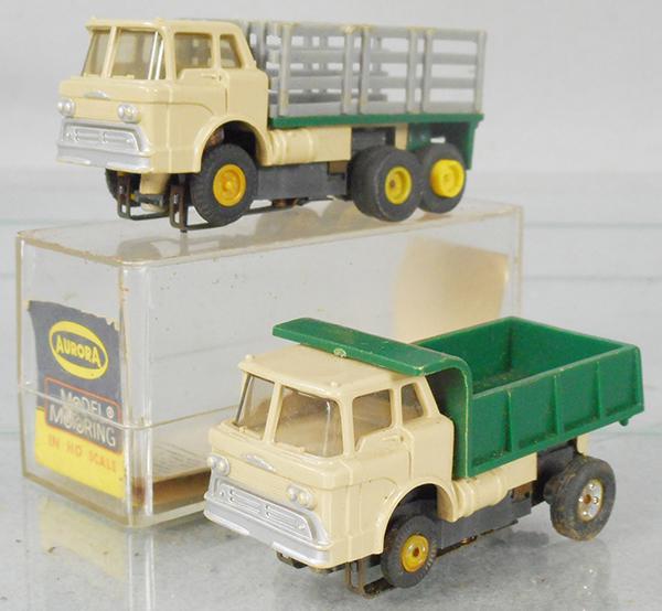 2 AURORA THUNDER JET SLOT CARS: Mack Stake Truck, w/orig box, minor wear, Mack Dump Truck, C7.