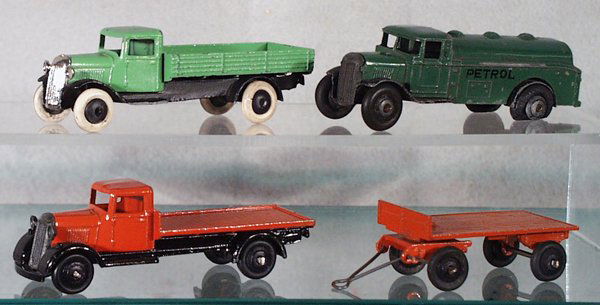 4 DINKY VEHICLES: 25C Flat Truck, 25G Trailer, 25A Wagon, grille replaced, 2 tires cracked, 25D Petrol Truck, paint worn, headlights broken off, C3, rest are C5-6. Please read and understand the Terms and Conditions in