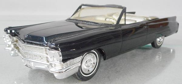 JOHAN 1963 CADILLAC PROMO: black w/gold interior, body warp, friction not working because of warp, C8.