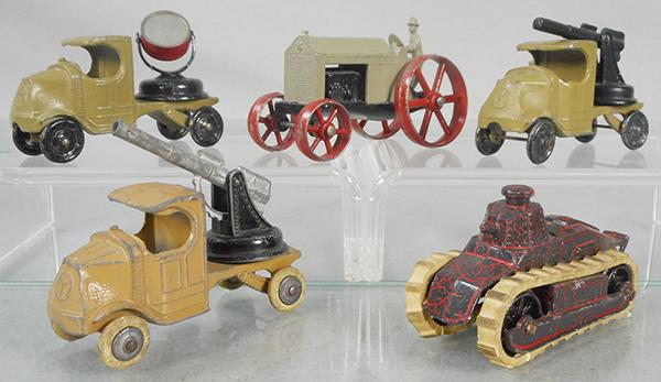 TOOTSIETOY ARMY VEHICLES: 4644 Mack Searchlight, 4654 Huber Tractor, no tow-hook version, 2 #4643 Mack AA Gun, 1 has rubber tires, 4647 Renault Tank, treads frozen, C5-7.