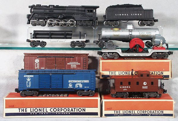 LIONEL TRAIN SET: O ga, 2020 loco, rubberstamping faded, 2466WX tender, 2411 flat w/pipes, 6555 Sunoco tank, orig box, 2458 PRR automobile car, some wear to doors & doorguides, 3650 searchlight extention, 6468 B&O auto