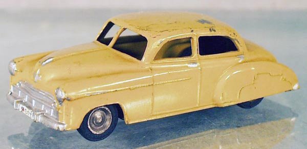 GASQUY CHEVROLET: Belgium, die cast w/tin chassis, yellow w/added paint embellishments, 1 tire has flat spots, C5.