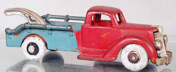 HUBLEY WRECKER: painted cast iron, nickel grille, front bumper broken, repainted w/repainted tires, C3-4.