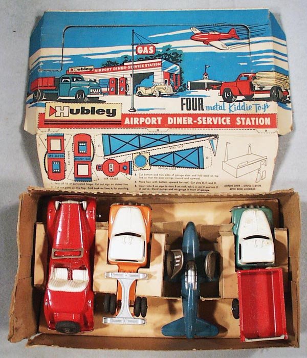 HUBLEY #12 AIRPORT DINER-SERVICE STATION SET: contains MGTD, red; Ford Log Truck, orange & white; Folding Wing Jet Plane, blue & silver, Dump Truck, green, white & red, all are die cast, orig box worn, designed to be made into playset, C7-8.