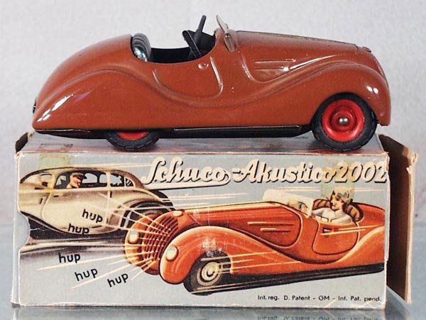 SCHUCO 2002 AKUSTICO: prewar, coffee brown, windups working, small dent in rear deck, w/instructions & key, orig box worn, C6-7.
