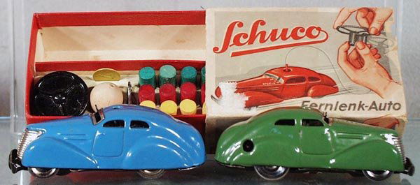 2 SCHUCO 3000 AUTOS: green auto is made in Germany, blue auto is made in US Zone Germany, both are windups working, 1 orig box only, complete with all accessories, box some wear, C6-7.
