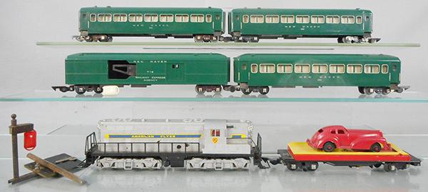 AMERICAN FLYER TRAIN SET: S ga, 370 GP7 switcher, w/orig box minor wear, 715 auto unloader, 718 mail pick up car w/pick up pole & orig box, 3 #650 New Haven Pullmans, orig boxes incom, C6-8.