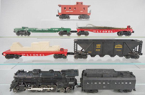 LIONEL 1035WS TRAIN SET: O ga, 2037 loco, 243W tender, 6821 flat w/crates, 6826 flat w/Christmas trees, 6636 Alaska hopper, 6361 log car, missing logs, 3665 Minuteman missile car, 6017 caboose, orig boxes worn, missing perf w