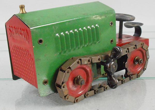 STRUCTO 44 TRACTOR: painted pressed steel, green & red, 8 in long, windup working, C6-7.