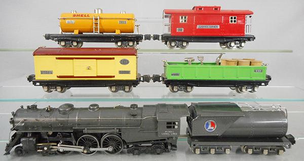 LIONEL 764W TRAIN SET: O ga, 763E loco, gunmetal, cab lettering has wear spots, 2263W oil tender, 2814 auto box car, 2812 gondola w/barrels & tools, 2815 Sunoco tank, 2817 tank, loco orig box & wrap marked 1937, tender box