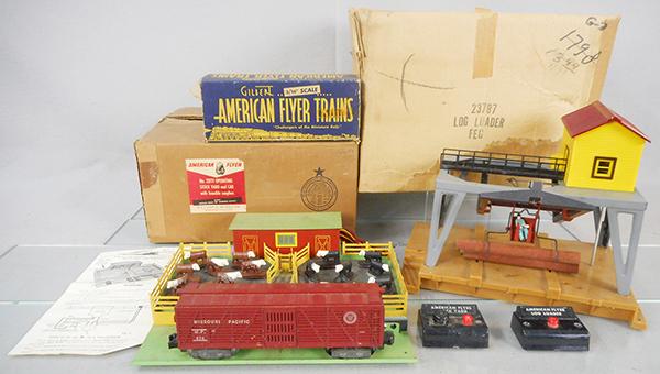 AMERICAN FLYER ACCESSORIES: S ga, 23771 operating stockyard w/976 stock car, cows & button, 23787 log loader w/button, orig boxes & inserts worn, C7.