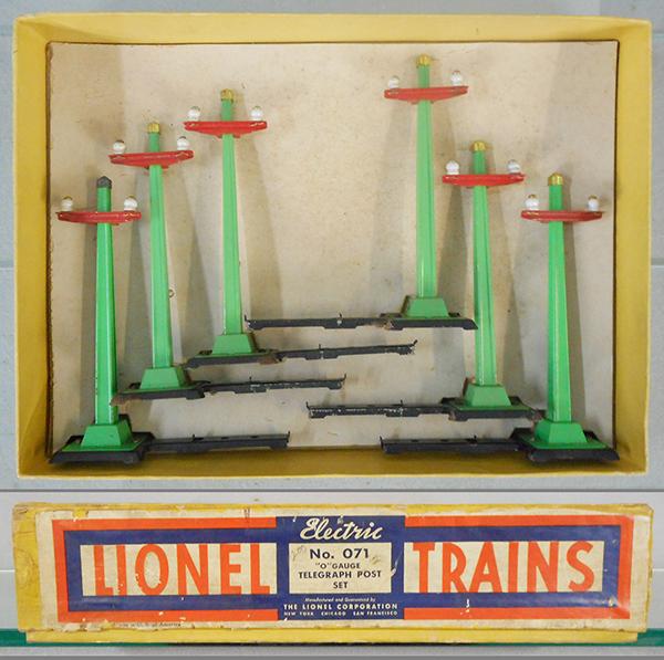 LIONEL 071 TELEGRAPH POST SET: O ga, 6 green telegraph poles, 2 have small surface oxidation spots on black bases, orig set box & inserts, C7.