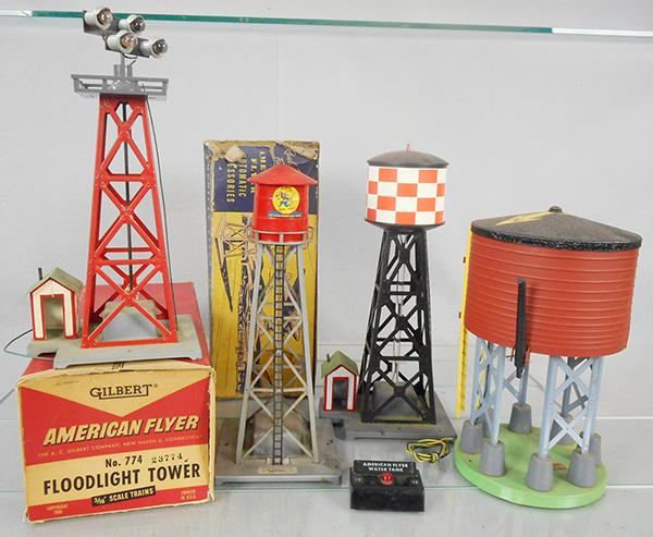 4 AMERICAN FLYER ACCESSORIES: S ga, 772 floodlight tower, orig box minor wear, 772 water tower w/LIRR decals on top, orig box incom, 772 water tower, 596 water tower w/button, C6-8.