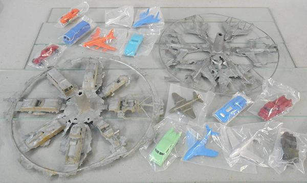 MIDGETOY LOT: 2 raw castings trees, 13 in diameter, 1 w/6 planes, other has 8 cars, w/14 vehicles sealed in plastic bags, C10.
