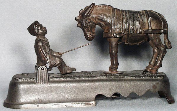 J&E STEVENS I ALWAYS DID SPISE A MULE BOY: on bench mechanical bank, unpainted cast iron, working, Good.
