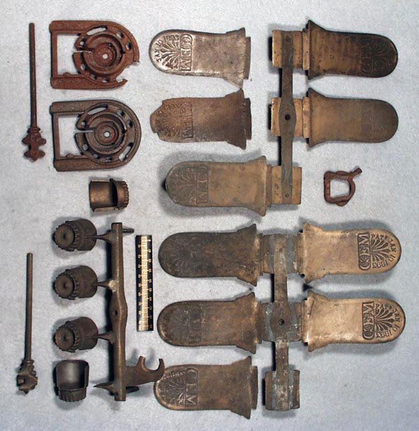 J&E STEVENS GEM REGISTERING BANK PARTS: 17 bronze pattern parts, some still attached to trees, knobs have casting defects, w/4 unfinished cast iron parts, 2 have damage & surface oxidation, w/orig paper label, Fair - Excellent.