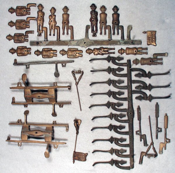 J&E STEVENS BOY SCOUT BANK PARTS: 40 bronze pattern pieces, some still attached to trees, Excellent.