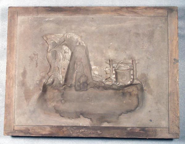 J&E STEVENS BOY SCOUT SAND MOLD: wood frame, 17 in by 13 in, for the front of the bank, Boy Scout written in chalk on frame, sand hardened & stained, Fair.
