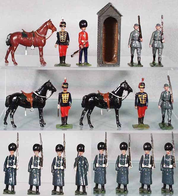 BRITAINS LOT: Set 182 11th Hussars, 6 pieces, C5; Set 329 Sentry Box w/Scot's Guard Sentry, C6-7; 3 pieces from Set 432 German Infantry, C8; Set 312 Grenadier Guards in Winter Cloaks, 8 pieces, C5-6.