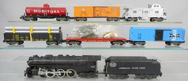 AMERICAN FLYER 20530 NIGHT HAWK TRAIN SET: S ga, 21130 Hudson loco & tender w/smoke & choo choo, 24109 C&O gondola w/pipes, missing wire hold downs, 24558 Christmas Tree transport w/sealed bag of trees & stakes, 24043 B&M box car, 24316 Mobilg