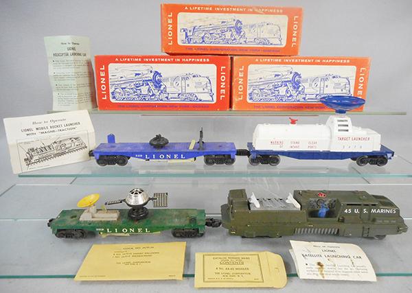 LIONEL TRAIN SET: O ga, 45 US Marine loco, 1 back step broken, 3519 satellite launching car, 3470 aerial target launching car w/packet, 3419 operating helicopter car, missing helicopter, w/packet & instruction sheets,