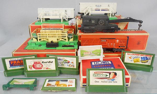 LIONEL LOT: O ga, 3472 operating milk car w/platform, 3656 operating cattle car w/platform, 310 billboard set, 3462 operating milk car w/platform, 2460 crane, orig boxes & inserts, 2 boxes are rough, C7-8.
