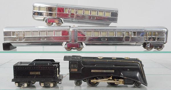 LIONEL 279E TRAIN SET: O ga, 265E loco, orig cab has surface cracks, 261TX tender w/2 drawbars, 619 front coach, 617 coach, 618 obsv, 1 car truck not shown in photo, but is included with the lot, C7-8.