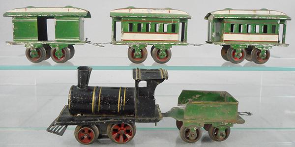 IVES 1901 TRAIN SET: O ga, handpainted tin, #1 loco, black w/gold trim, windup not working, #1 tender, green, 1 broken coupler, baggage & 2 coaches, green & white w/red highlights, missing 1 coupler, baggage & coach are i