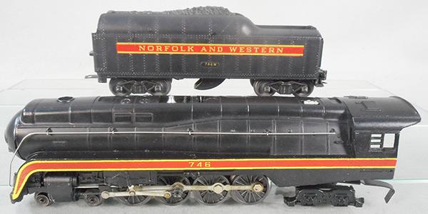 LIONEL 746 N&W LOCO & TENDER: O ga, 746 Norfolk & Western loco, restriped, 746W tender, short stripe, w/factory double heatstamp on both sides, orig boxes & master carton worn, tender flap has a torn end flap, C7-8.