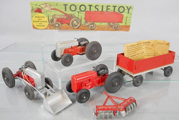 TOOTSIETOY FARM TOYS: 290 Tractor w/scoop, shovel & wagon, glue repair to hitch base, orig box worn, missing 1 end, 2810 Tractor & Harrow, tractor has a broken eyelet hitch, C6-8.