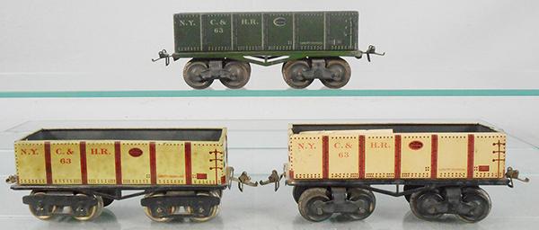 3 IVES FREIGHT CARS: O ga, 63 gondola, green w/green frame, ca 1913, 63 gondola, gray, ca 1925, 63 gondola, pinkish hue to litho, "capacity 100,000 lbs" on sides, ca 1914, C6.