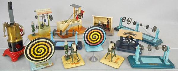 FLEISCHMANN LIVE STEAM TOYS: Steam Engine, 8 in, 2 #209 Color Wheels, Man At Well, 253 Blacksmith, 225 Sand Loader, 218 Transmission, 249 Saw, 2 Transmissions, 2 Grinders, w/7 worn orig boxes, ca 1950s, C4-8.