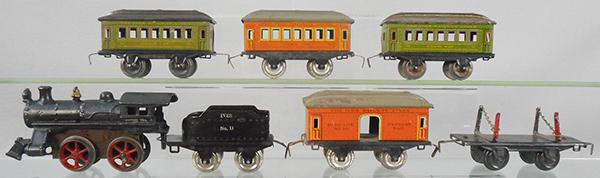 IVES TRAIN SET: O ga, #5 loco, painted cast iron, windup working, 11 tender, 2 #51 chair cars, green, no paint on roof, 50 baggage, paint flaking on roof, 51 chair, 57 lumber, C5-7.