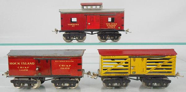3 IVES FREIGHT CARS: O ga, 67 caboose, minor paint flaking on roof, 64 Rock Island box car, paint worn on roof, 65 stock car, ca 1920s, C6-7.