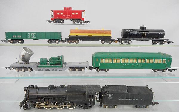 AMERICAN FLYER TRAIN SET: S ga, 312 Pacific loco & tender w/smoke & choo choo, 646 floodlight car, 650 New Haven Pullman, 631 T&P gondola, 717 operating log car, 625 Shell tank, 630 caboose, C6-7.