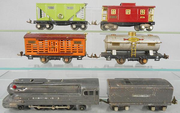 LIONEL TRAIN SET: O ga, 1668 loco, 1668T tender, 806 stock, 804 tank, some surface oxidation, 653 hopper, 657 caboose, C5-6.