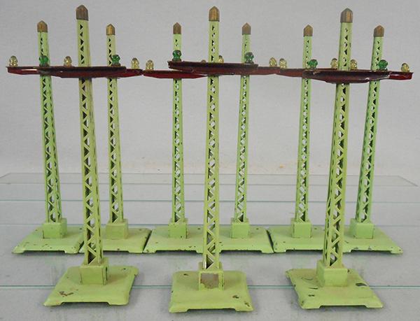 9 LIONEL 60 TELEGRAPH POLES: O ga, green w/glass insulators, some paint flaking, C5-7.