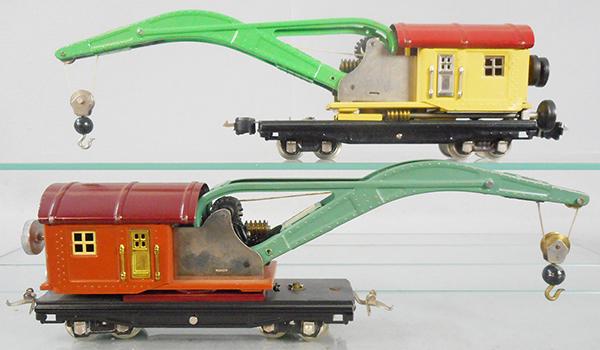 2 LIONEL 810 CRANES: O ga, yellow crane has touch up to yellow cab, terra cotta crane has Ives couplers, both are working & have paper labels on booms, C7-8.