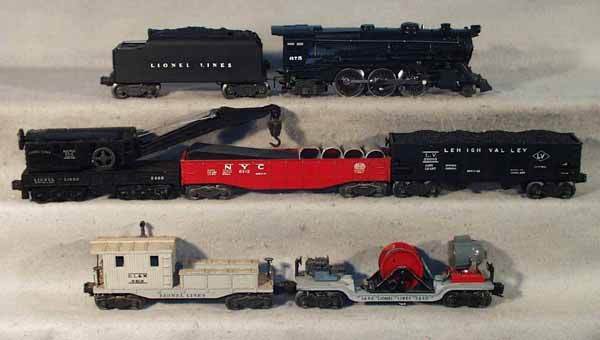 LIONEL TRAIN SET: O ga, 675 loco, repainted, 6466WX tender, frame repainted, 2456 hopper, 6342 culvert gondola w/4 culverts, 2460 derrick, 3650 searchlight extention car, 6419 work caboose, caboose dirty, C5-6.
