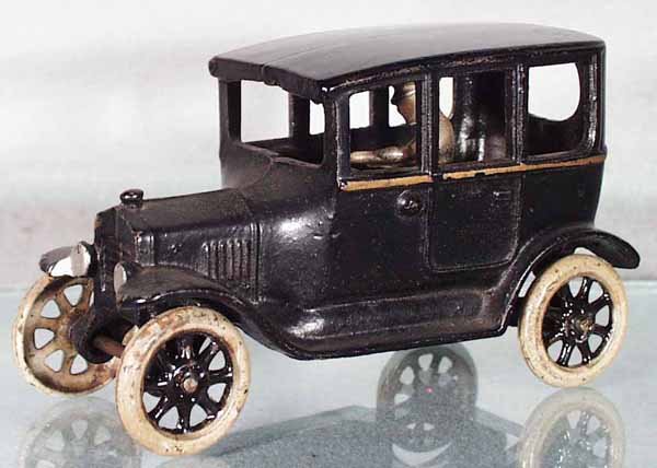 ARCADE FORD TUDOR SEDAN: painted cast iron, 6 1/2 in long, minor wear, C6.