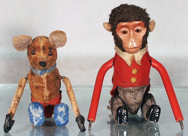 2 SCHUCO TUMBLING FIGURES: 880 Mouse, some rust spots, 883 Monkey, missing plastic hands, both are windup working, C4-6.