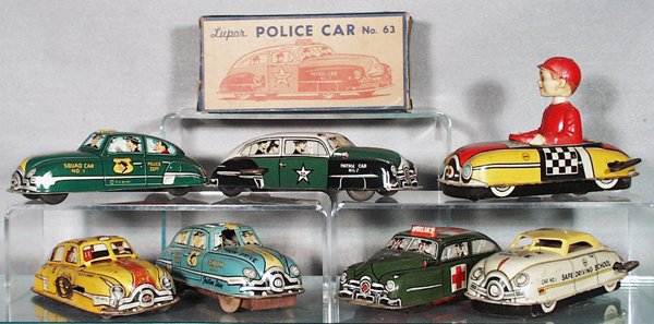7 MARX & LUPOR VEHICLES: litho tin & plastic, Lupor Police Car & Ambulance, 7 in long, windups not working, 1 orig box only; Marx Car w/Bobble Head Driver, windup working, Yellow Cab, windup not working, 1 tire broken, dented