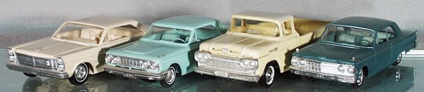 4 AMT PROMOS: plastic, 1 has a tin base, 1965 Ford Galaxie, 1964 Ford Fairlane, 1960 Ford Pick Up, 1962 Mercury Challenger, some oxidation on axles, 2 are friction not working, C6-8.
