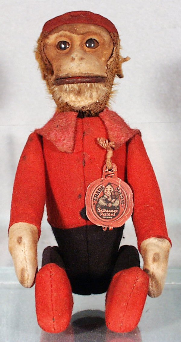 SCHUCO 181 SCHNICO MONKEY: working, head missing fur, missing 1 button & tassel, w/tag, 8 in long, C4.