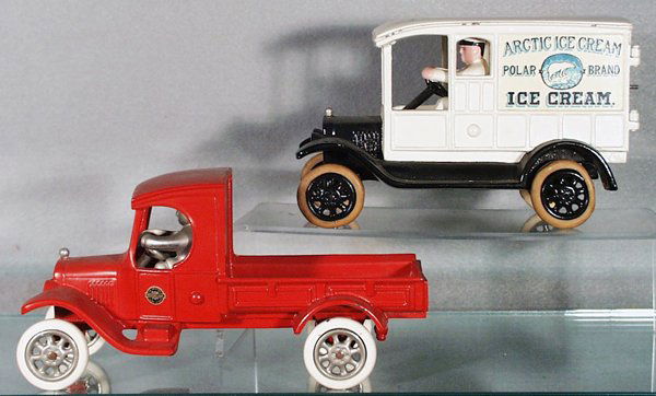 2 MOTORCADE TOYS TRUCKS: painted cast iron, Arctic Ice Cream Tuck, 7 1/2 in long, white rubber tires worn, 1 side decal has scratch; Pick Up Truck, white rubber tires, 8 1/4 in long, orig boxes minor wear, C6-7.